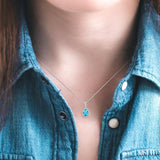 10x7 MM Pear Shape Blue Topaz and 1/20 Ctw Single Cut Diamond Pendant in Sterling Silver with chain